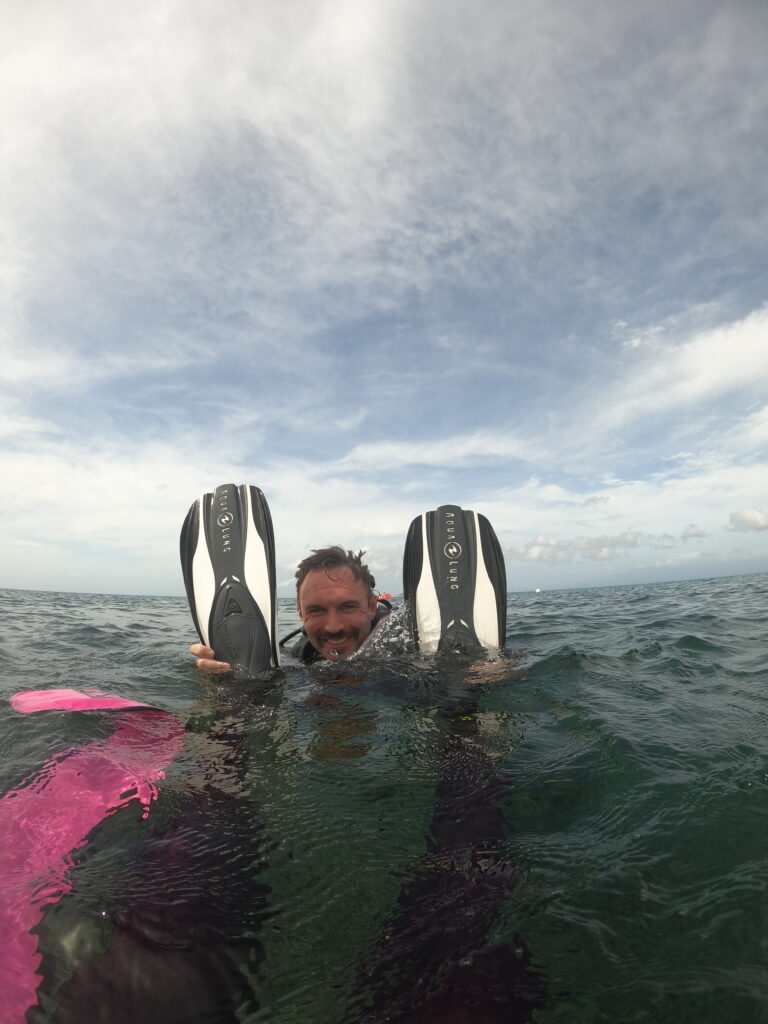 During padi open water course tired diver tow at the surface on our house reef in siquijor island philippines